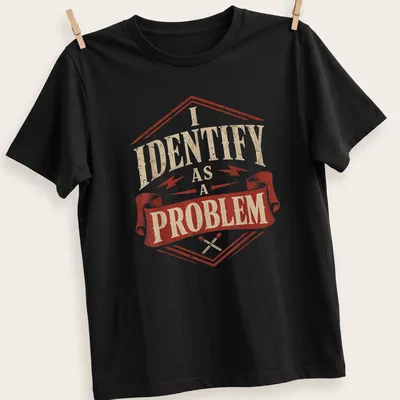 Vintage distressed t-shirt featuring a sarcastic badge with text: I IDENTIFY as A PROBLEM