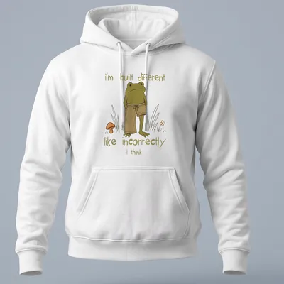 Cartoon frog illustration with humorous text about being different — printed on a unisex hoodie