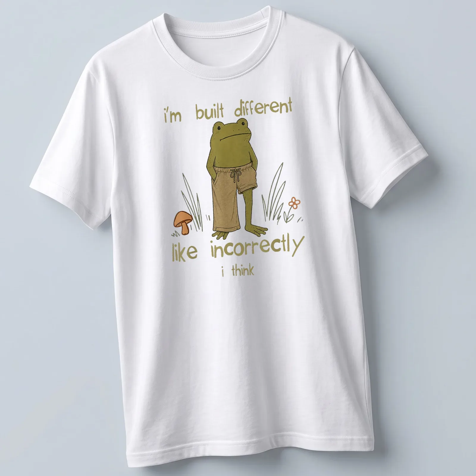 Cartoon frog illustration with humorous text about being different — printed on a unisex t-shirt