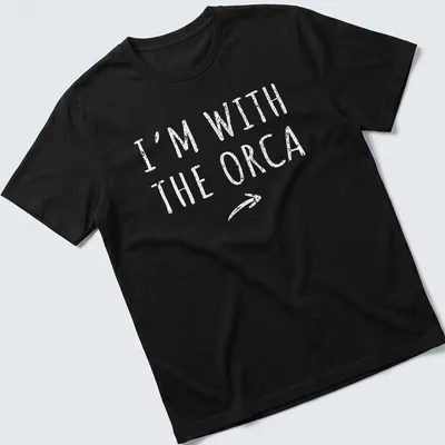 Playful orca-themed shirt with bold text 'I'm With The Orca' for Halloween