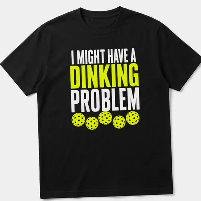 Retro bold text on a shirt saying 'I Might Have A Dinking Problem' with pickleball imagery. — printed on a unisex t-shirt