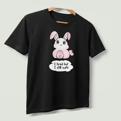 Kawaii pink bunny t-shirt with playful text about being cute despite tiredness. — printed on a unisex t-shirt (angled view)