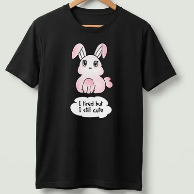 Kawaii pink bunny t-shirt with playful text about being cute despite tiredness.