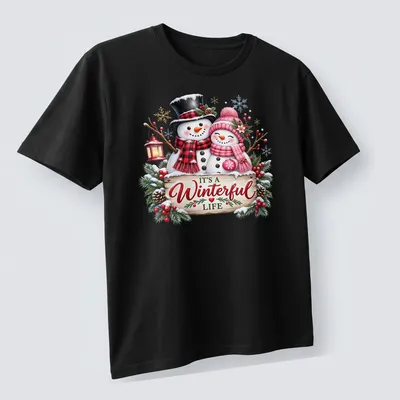 Festive snowman couple with text 'IT'S A Winterful Life' in colorful holiday design. — printed on a unisex t-shirt (angled view)