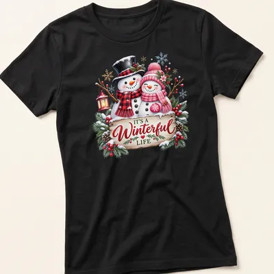 Festive snowman couple with text 'IT'S A Winterful Life' in colorful holiday design. — printed on a women's shirt