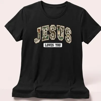 Camo print t-shirt featuring 'JESUS' in camouflage text — printed on a women's shirt