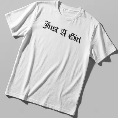 Black gothic lettering on a t-shirt reads Just A Girl