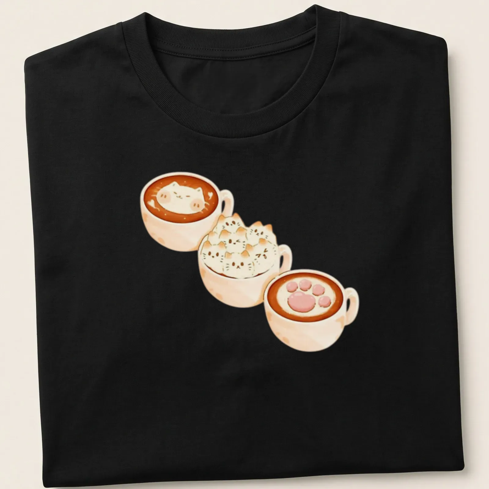 Kawaii print of cat lattes in cozy coffee cups with frothy artwork — printed on a unisex t-shirt