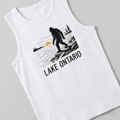 Silhouette of Bigfoot against a sunset with text Lake Ontario — printed on a tank top