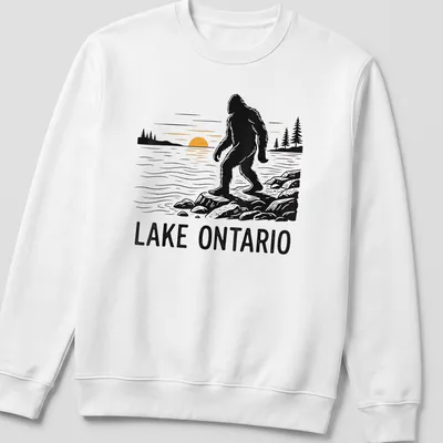 Silhouette of Bigfoot against a sunset with text Lake Ontario — printed on a unisex sweatshirt