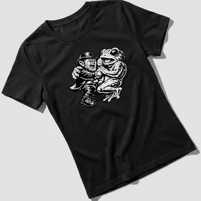 Bold cartoon design of Leprechaun and Loveland Frogman in black and white — printed on a women's shirt