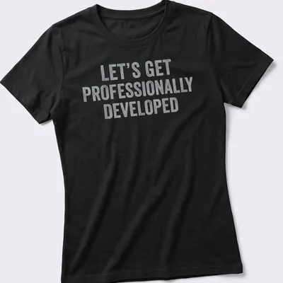 Bold distressed text t-shirt with a humorous professional development quote — printed on a women's shirt