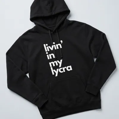 Typography t-shirt with the phrase 'livin' in my lycra' in bold letters — printed on a unisex hoodie