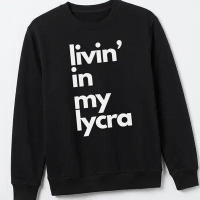 Typography t-shirt with the phrase 'livin' in my lycra' in bold letters — printed on a unisex sweatshirt