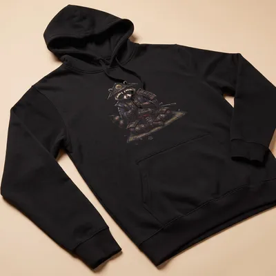 Ukiyo E style illustration of a meditating raccoon samurai in rich colors — printed on a unisex hoodie