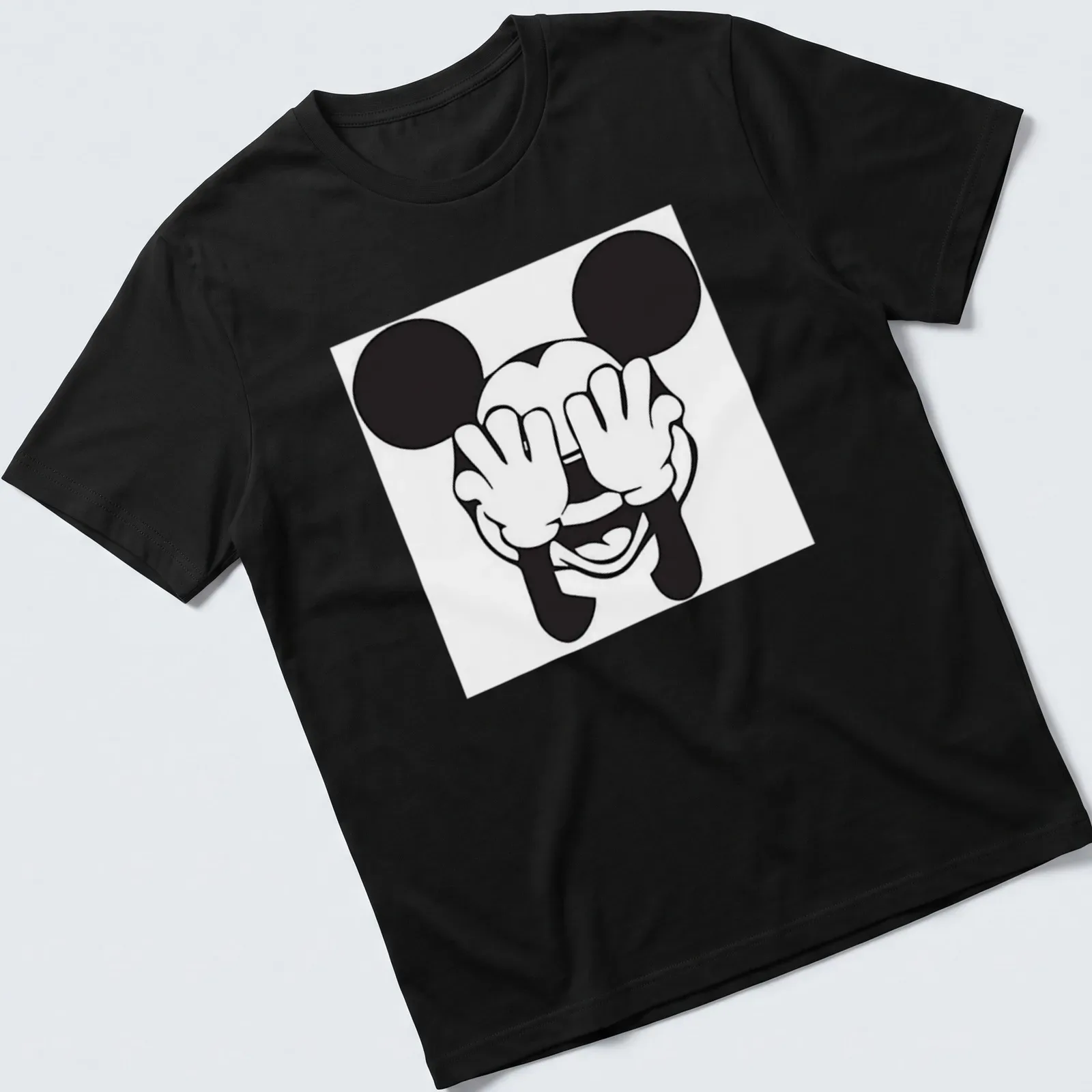 Kawaii line-art of Mickey Mouse covering his eyes in black and white — printed on a unisex t-shirt
