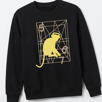 Minimalist line-art of a monkey with the text Monkey Gone To Heaven in yellow and orange — printed on a unisex sweatshirt
