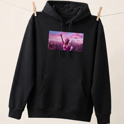 Vibrant digital art of the Statue of Liberty styled as Nicki Minaj in pinks and purples — printed on a unisex hoodie