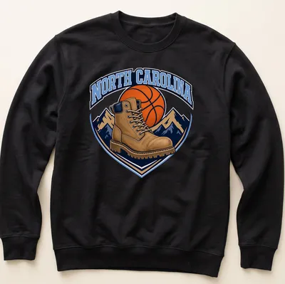 Vintage North Carolina Basketball T-shirt featuring a work boot and basketball graphic — printed on a unisex sweatshirt