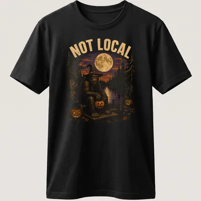 Vintage Halloween tee with cartoon Bigfoot on a dock surrounded by pumpkins