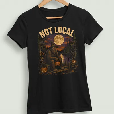 Vintage Halloween tee with cartoon Bigfoot on a dock surrounded by pumpkins — printed on a women's shirt
