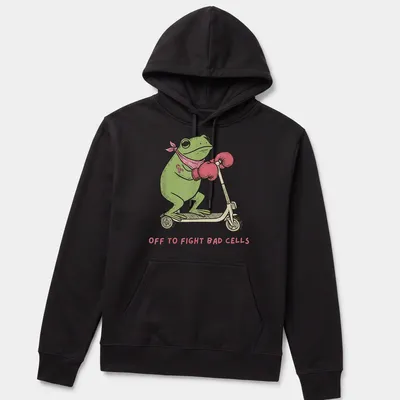 Cartoon frog on a scooter with text saying 'Off to Fight Bad Cells' in playful colors. — printed on a unisex hoodie