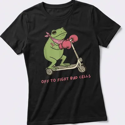 Cartoon frog on a scooter with text saying 'Off to Fight Bad Cells' in playful colors. — printed on a women's shirt