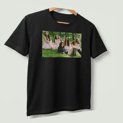 Photographic print of a young woman in a blue sweater and black boots — printed on a unisex t-shirt (angled view)