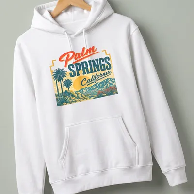 Vintage retro t-shirt featuring palm trees and mountains with sunset colors. — printed on a unisex hoodie