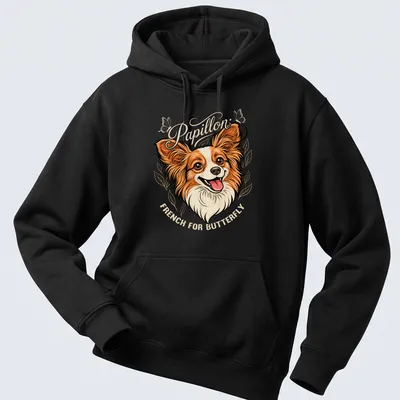 Illustration of a Papillon dog with 'Papillon French For Butterfly' text in warm colors — printed on a unisex hoodie