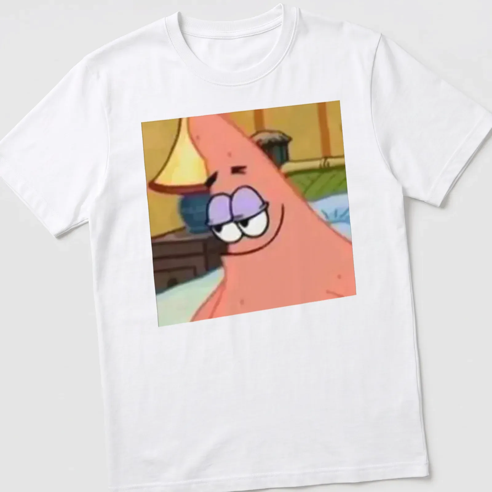 Cartoon Patrick Star character smiling in vibrant colors — printed on a unisex t-shirt