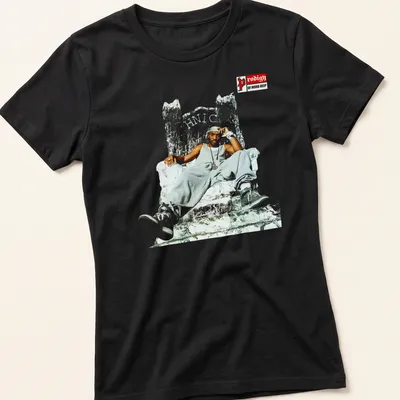 Illustration of Prodigy of Mobb Deep seated on a throne with high-contrast colors. — printed on a women's shirt