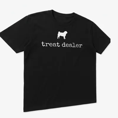 Simple silhouette of a pug with the text 'treat dealer' beneath in bold lettering — printed on a unisex t-shirt (angled view)