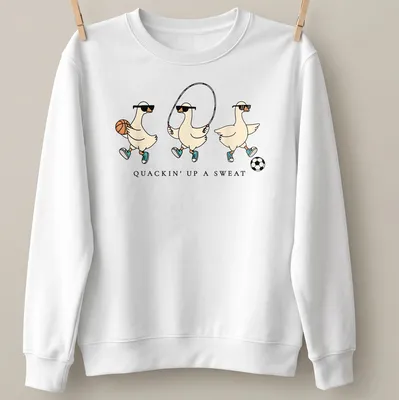 Cartoon goose with humorous text, Quackin' Up A Sweat, in vibrant colors — printed on a unisex sweatshirt