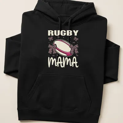 Cute Rugby Mama t-shirt with pink bows and playful rugby ball design — printed on a unisex hoodie