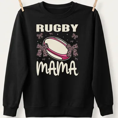 Cute Rugby Mama t-shirt with pink bows and playful rugby ball design — printed on a unisex sweatshirt