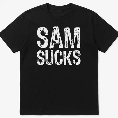 Bold typography shirt with the text 'SAM SUCKS' printed prominently.