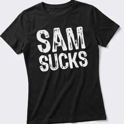 Bold typography shirt with the text 'SAM SUCKS' printed prominently. — printed on a women's shirt