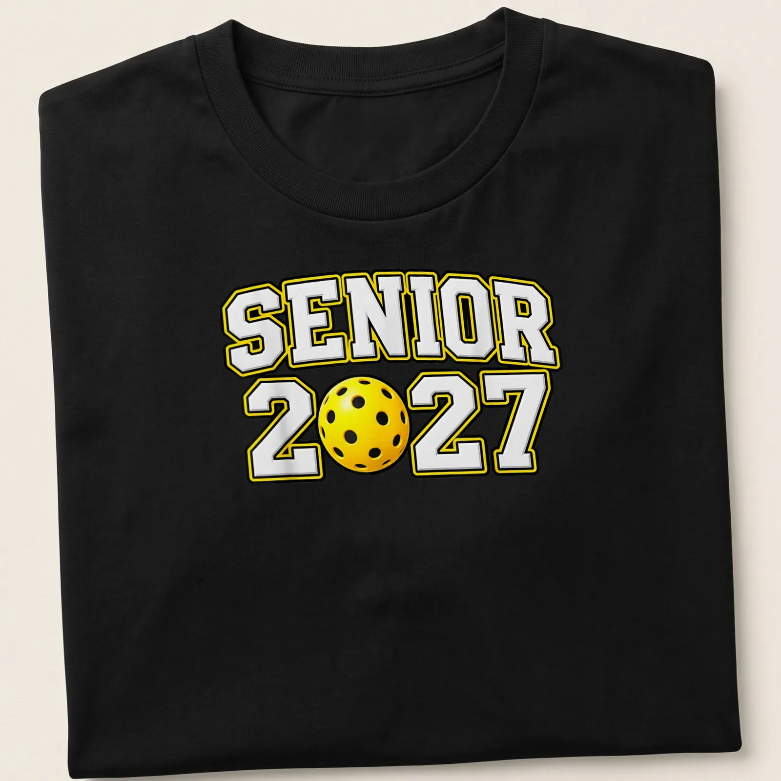Graduation shirt with 'Senior 2027' in bold sports lettering over a pickleball graphic — printed on a unisex t-shirt