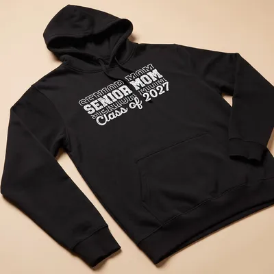Bold text Senior Mom Class of 2027 graduation t-shirt in white — printed on a unisex hoodie