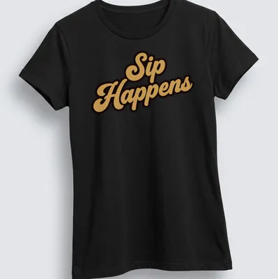 Bold script t-shirt with the humorous quote Sip Happens in gold on black background — printed on a women's shirt