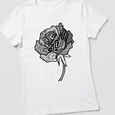 Black and white line art T-shirt featuring the text 'Smell The Roses' and a rose illustration — printed on a women's shirt