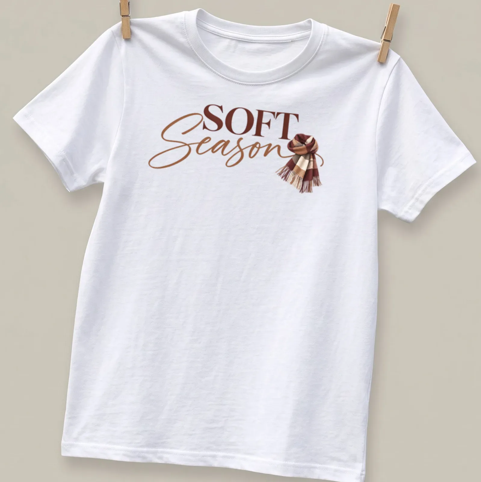 Autumn-themed t-shirt featuring a cozy scarf and the text 'Soft Season' in modern script. — printed on a unisex t-shirt