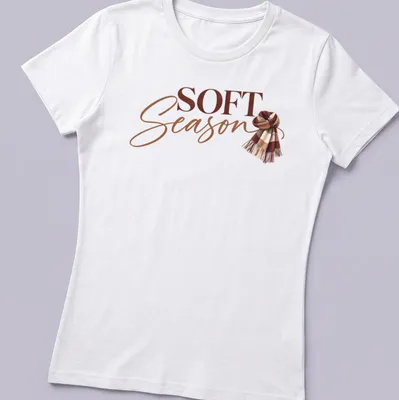 Autumn-themed t-shirt featuring a cozy scarf and the text 'Soft Season' in modern script. — printed on a women's shirt