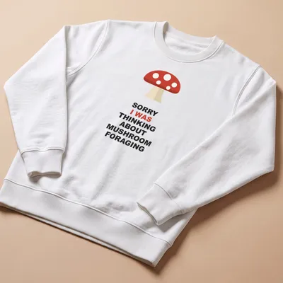 Mushroom foraging themed t-shirt with bold text and simple illustration — printed on a unisex sweatshirt