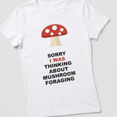 Mushroom foraging themed t-shirt with bold text and simple illustration — printed on a women's shirt