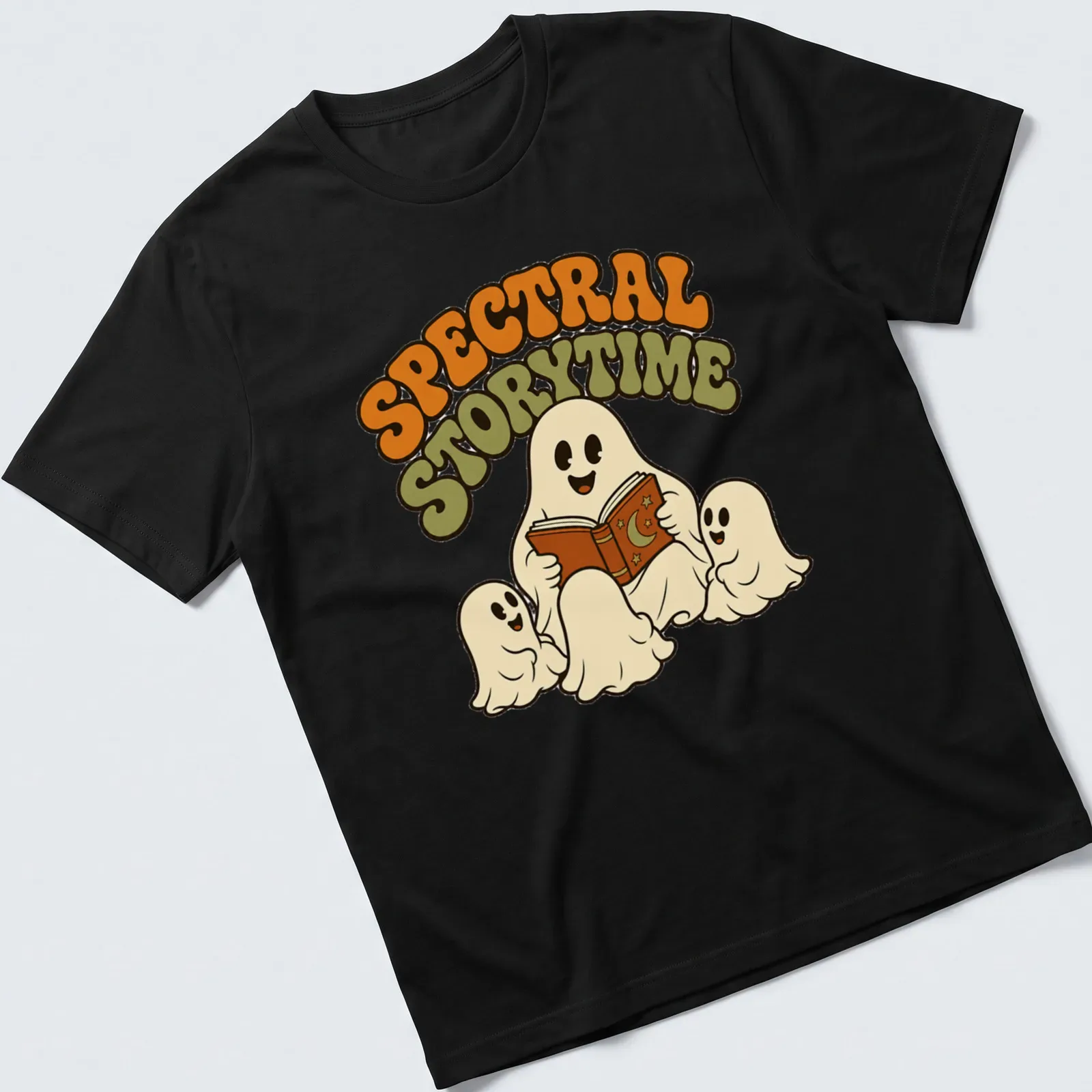 Whimsical retro design of ghosts reading a book with Spectral Storytime text — printed on a unisex t-shirt