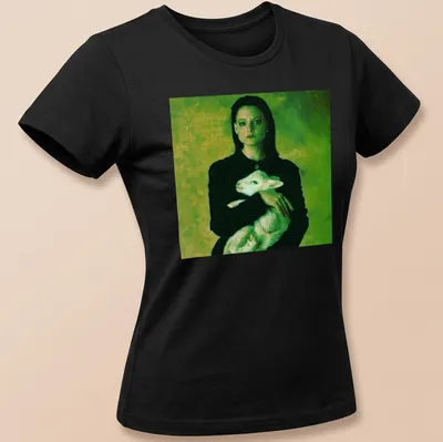 Vintage style t-shirt of a woman holding a lamb in green, black, and white — printed on a women's shirt
