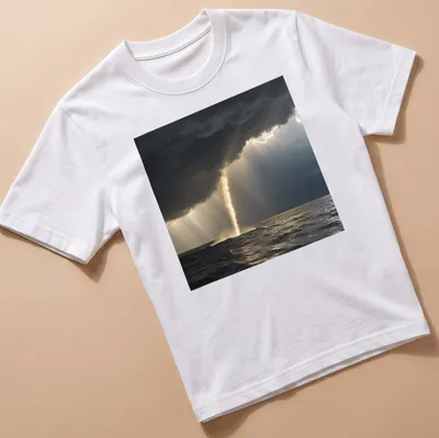 Dramatic photography of a golden waterspout against dark gray and blue skies