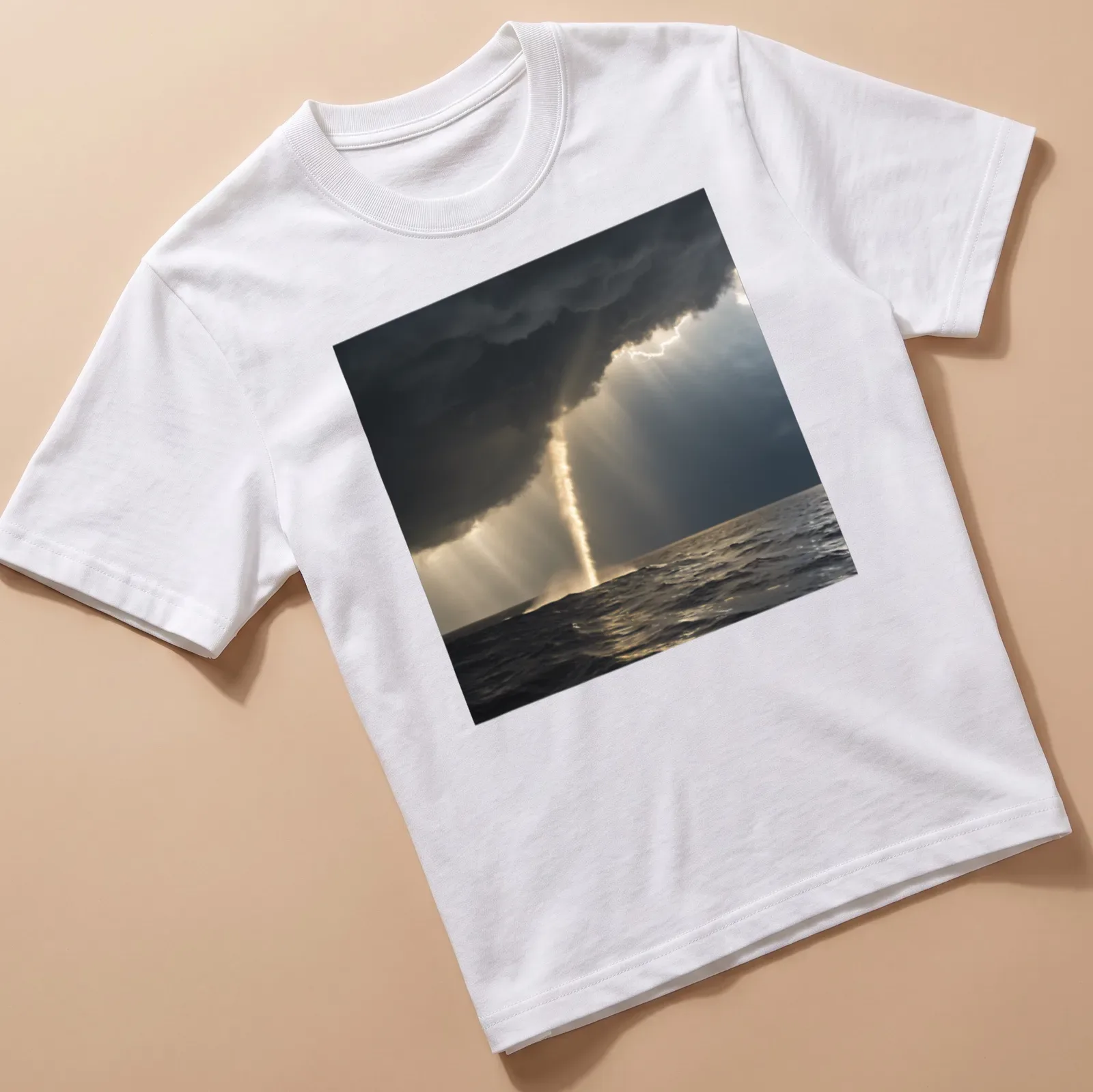 Dramatic photography of a golden waterspout against dark gray and blue skies — printed on a unisex t-shirt